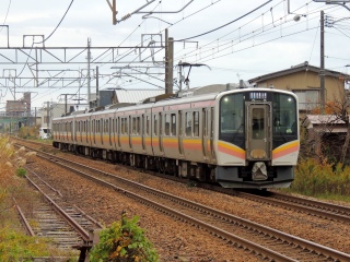 E129�n �M�z�{�� ~����~